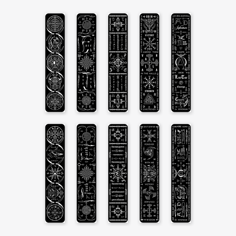 Ten Talisman kinesiology tape strips laid flat, white designs printed on black tape - Viking runes, Reiki chakra, dreamcatcher, Feng Shui and Latin mottoes, each in horizontal and vertical layouts