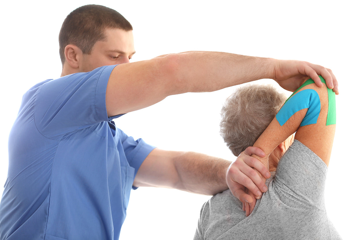 Person wearing kinesiology tape for elbow pain support